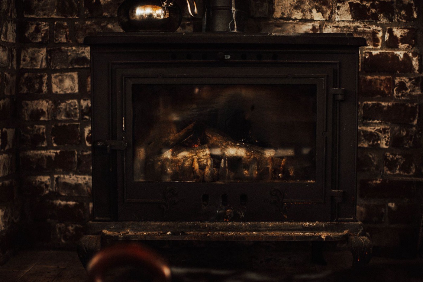 Rustic brick fireplace of the kind still warming older Dieppe homes